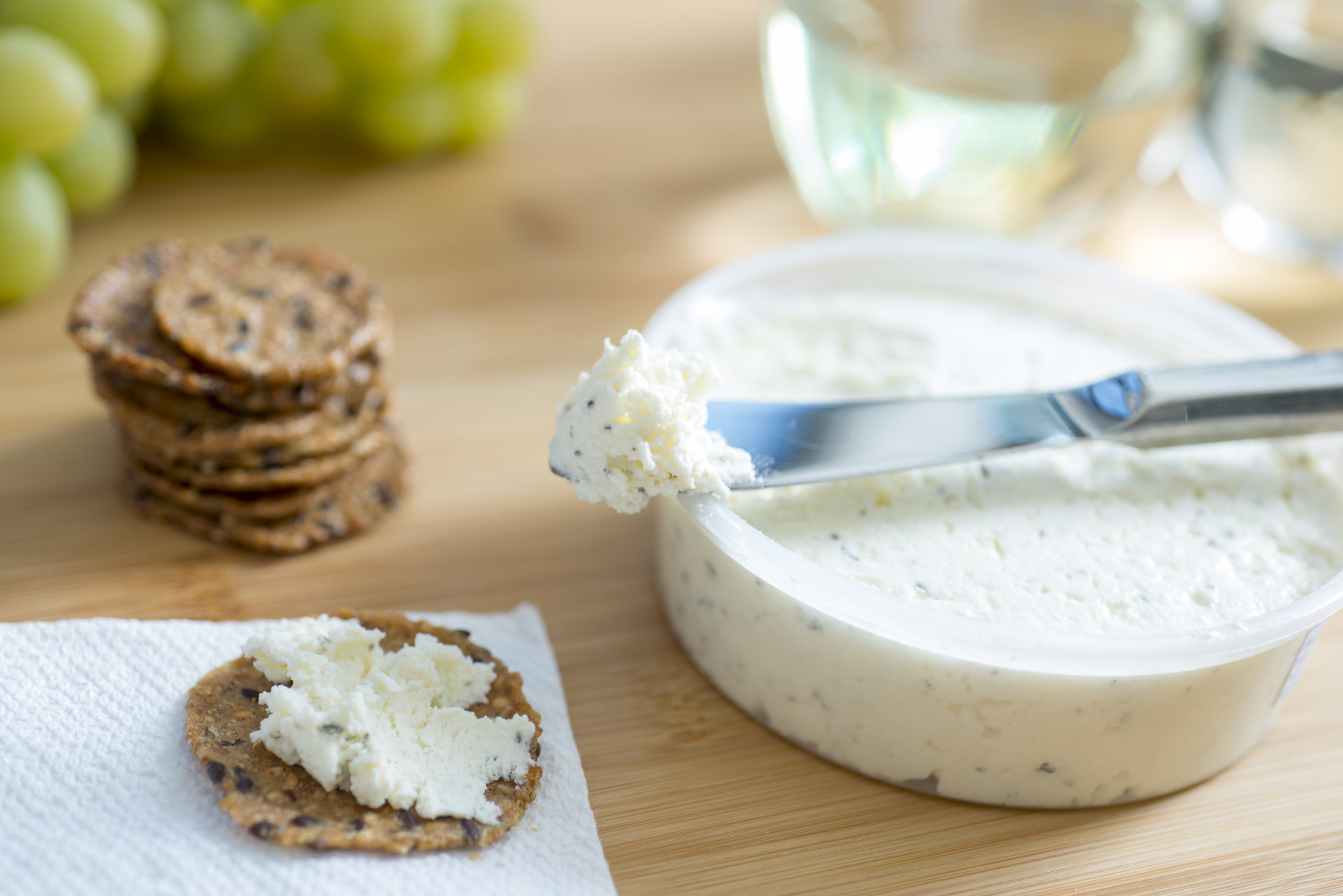 Adelisca spreadable cheese smeared on a cracker